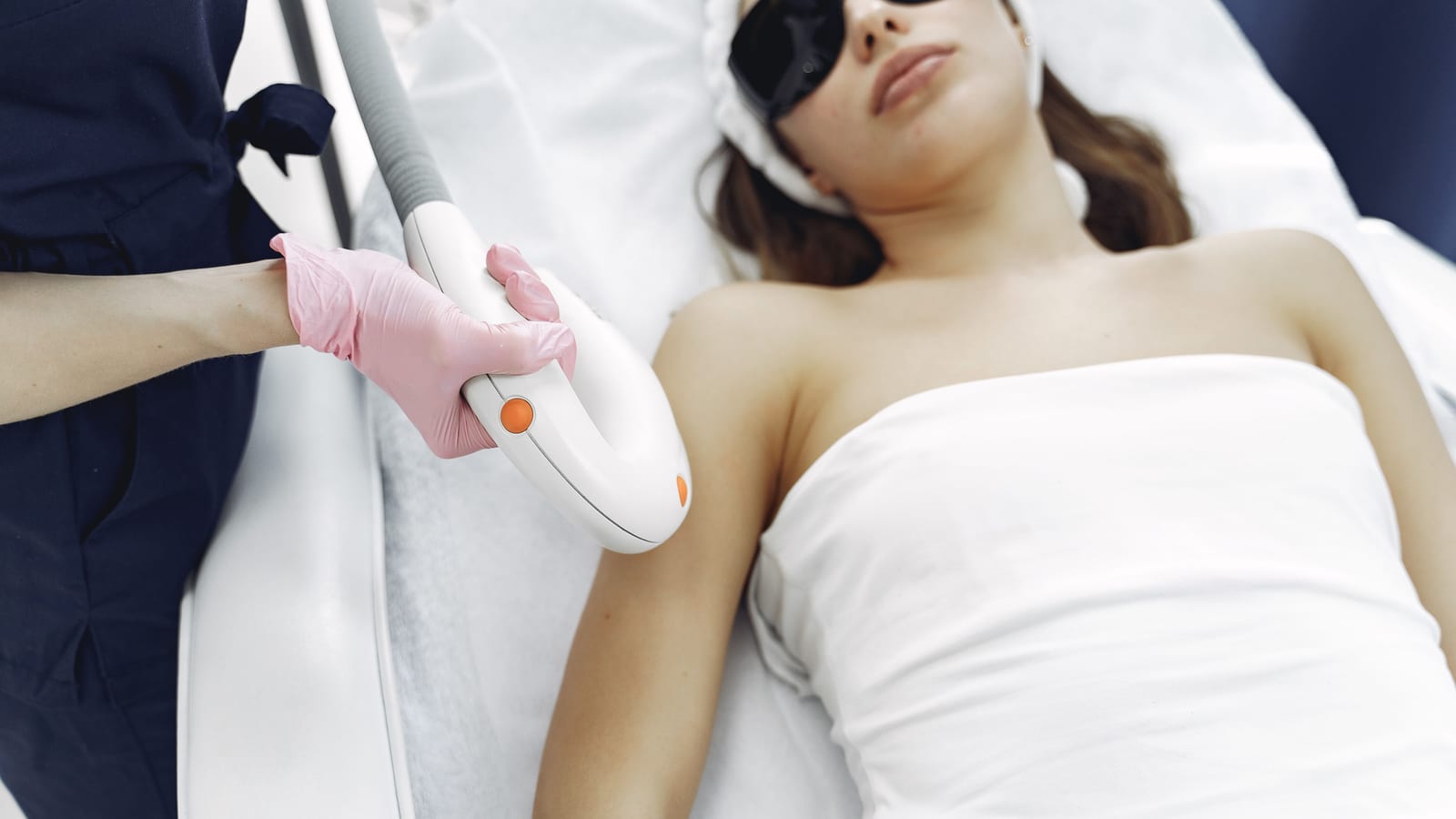 A patient in protective eyewear during a light-based laser treatment in Mission Viejo